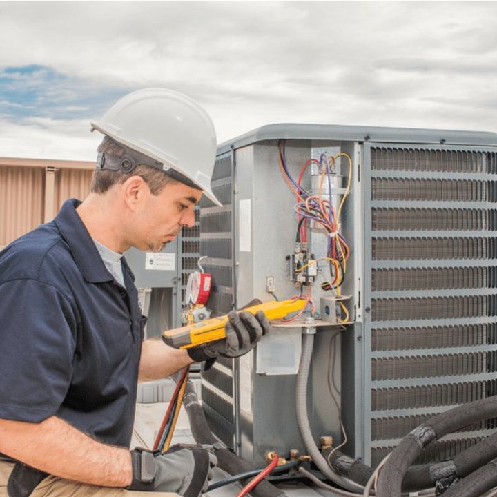 Ilderton Heating & Cooling HVAC technician on a service call in Ilderton, Ontario